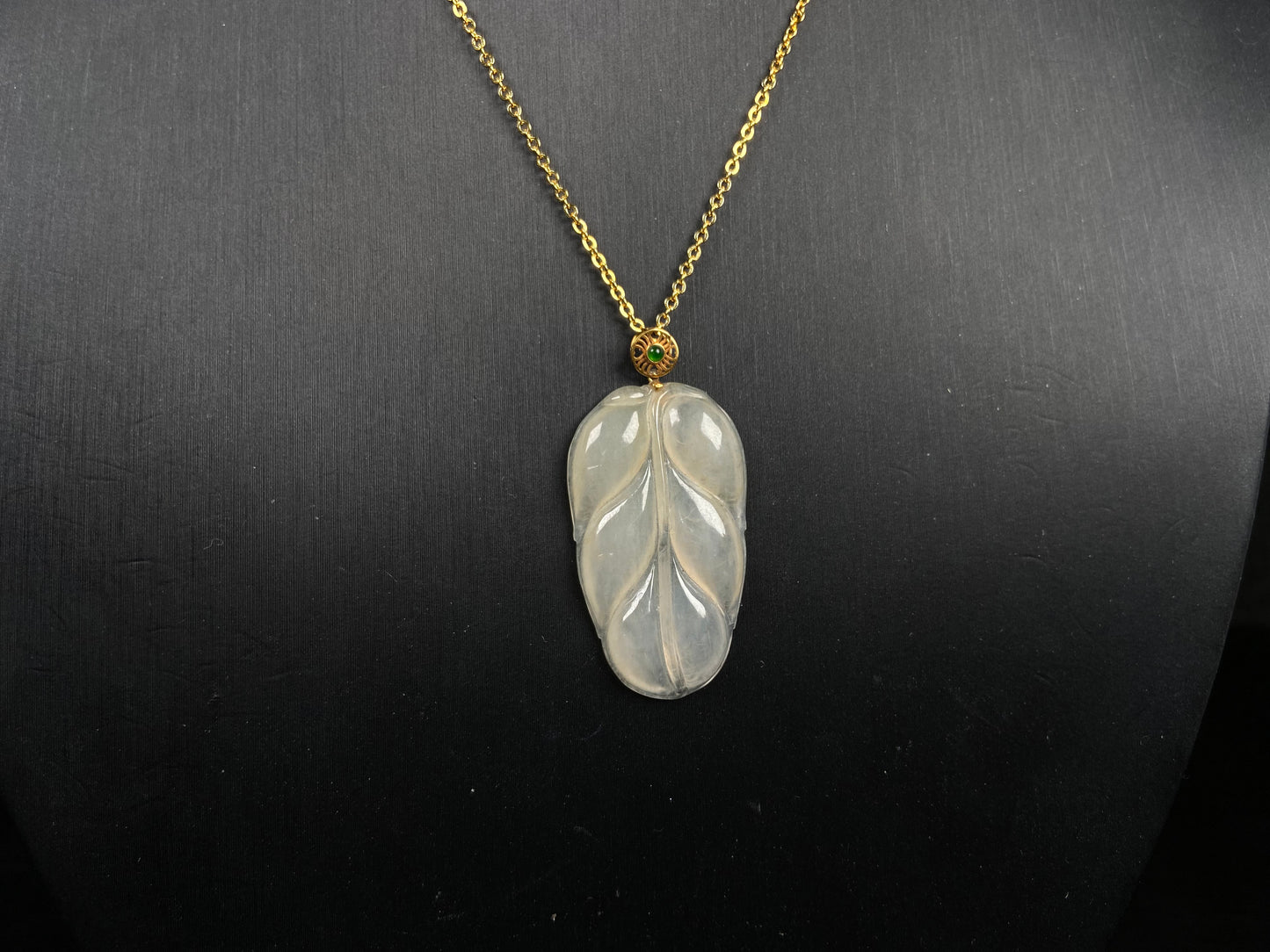 A leaf warm yellowish white jadeite pendant.