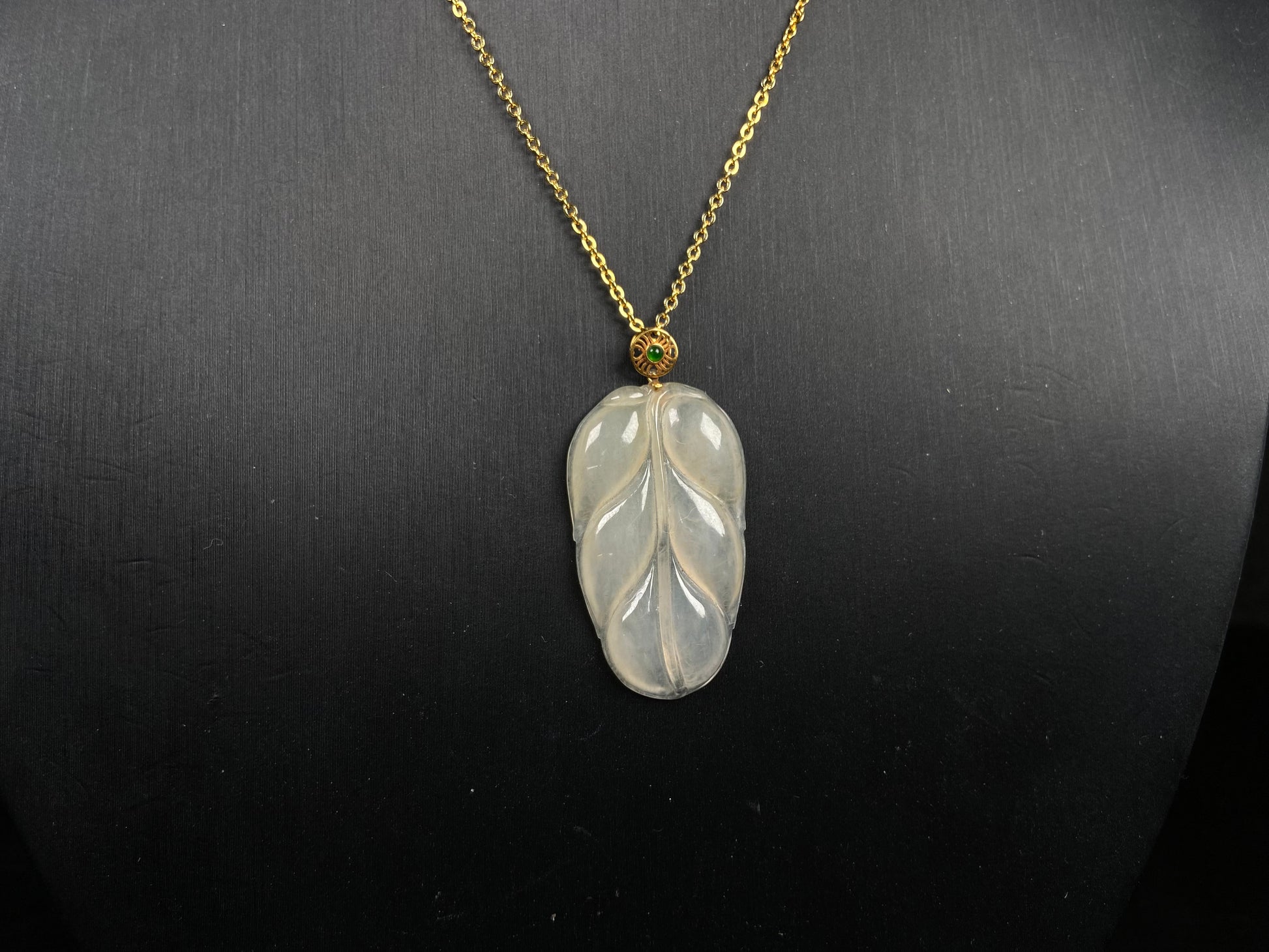 A leaf warm yellowish white jadeite pendant.
