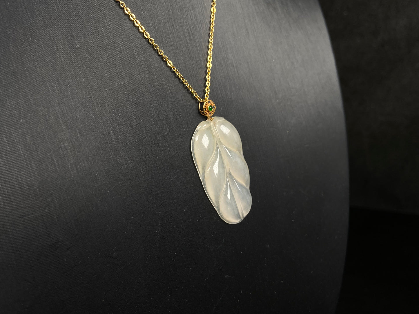 A leaf warm yellowish white jadeite pendant.