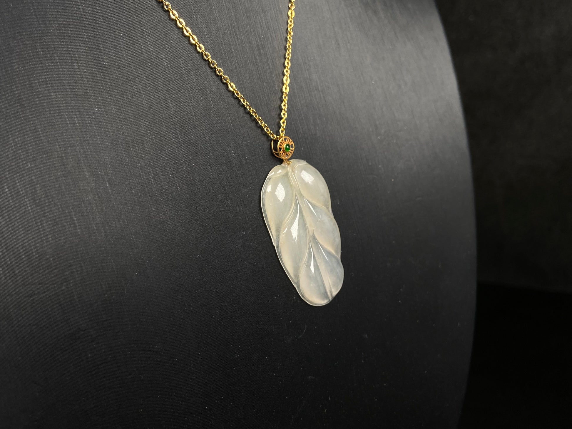 A leaf warm yellowish white jadeite pendant.