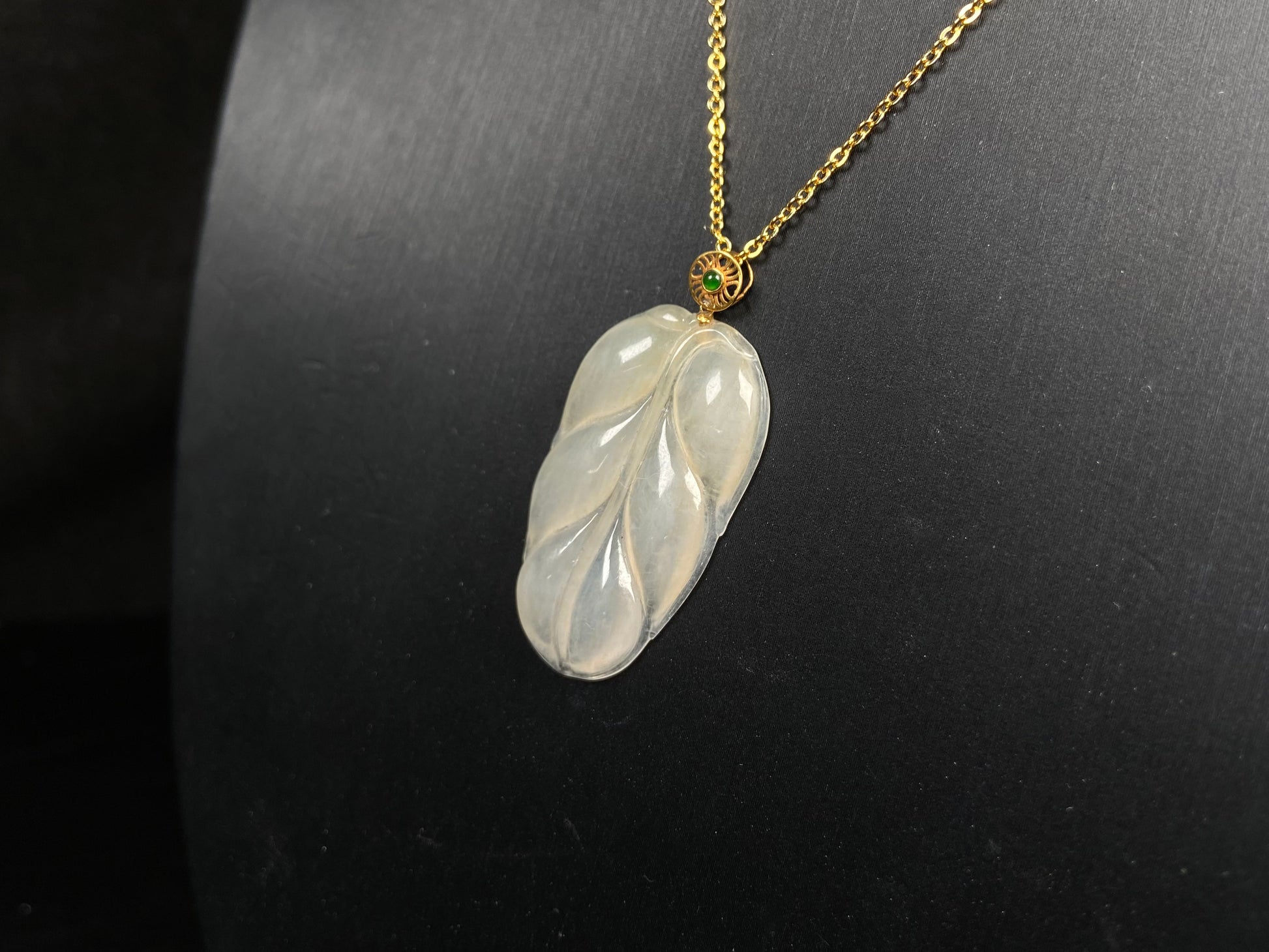 A leaf warm yellowish white jadeite pendant.