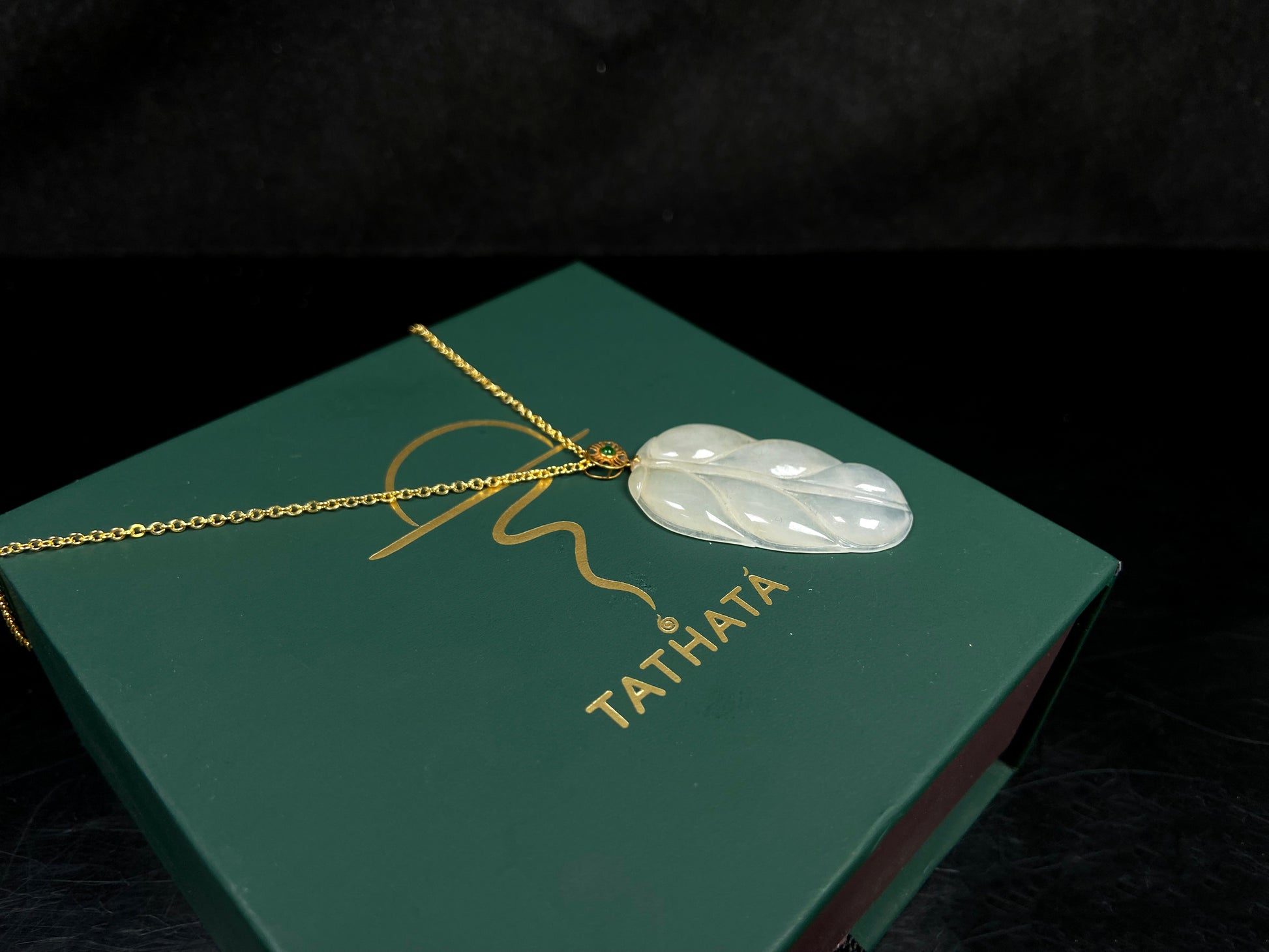 A leaf warm yellowish white jadeite pendant.