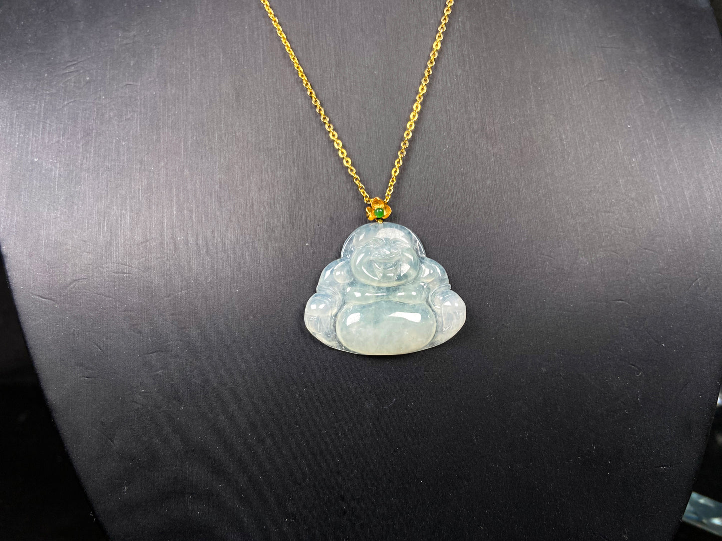 A icy pale green Maitreya jadeite pendant.