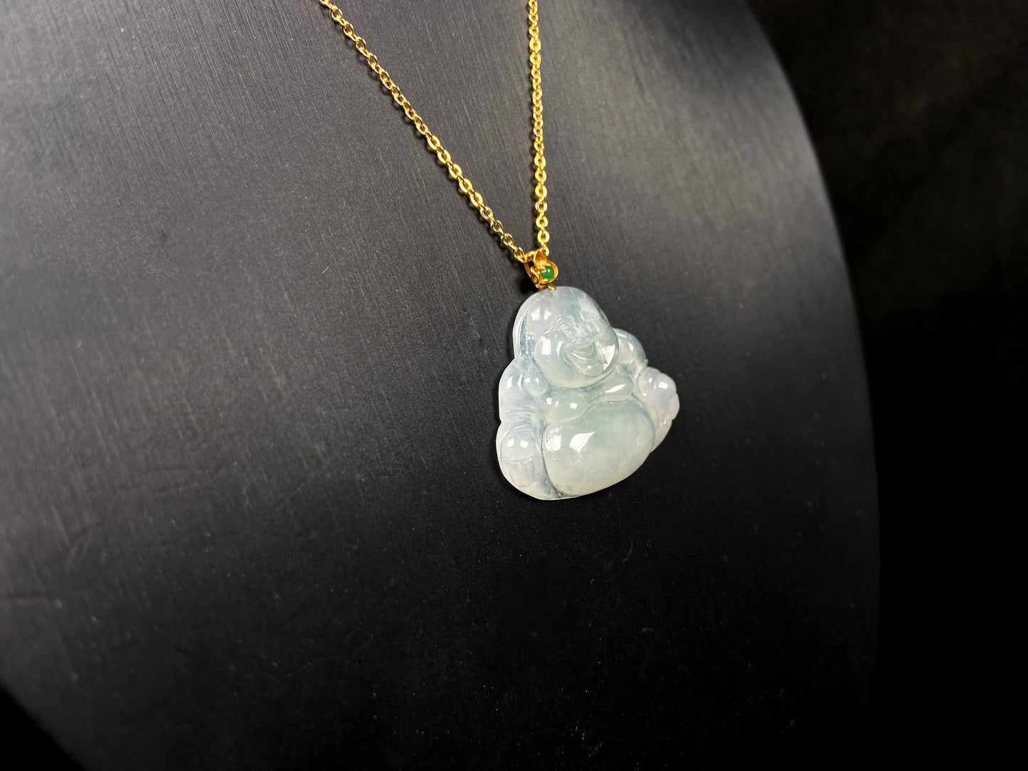 A icy pale green Maitreya jadeite pendant.