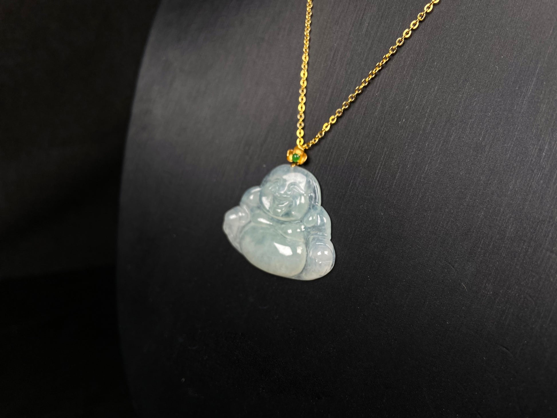 A icy pale green Maitreya jadeite pendant.