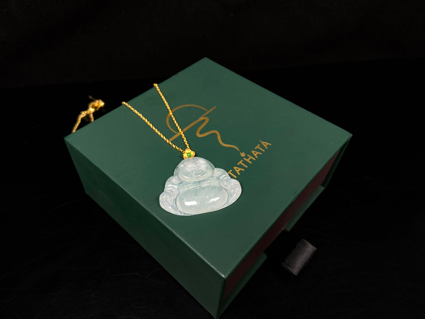 A icy pale green Maitreya jadeite pendant.