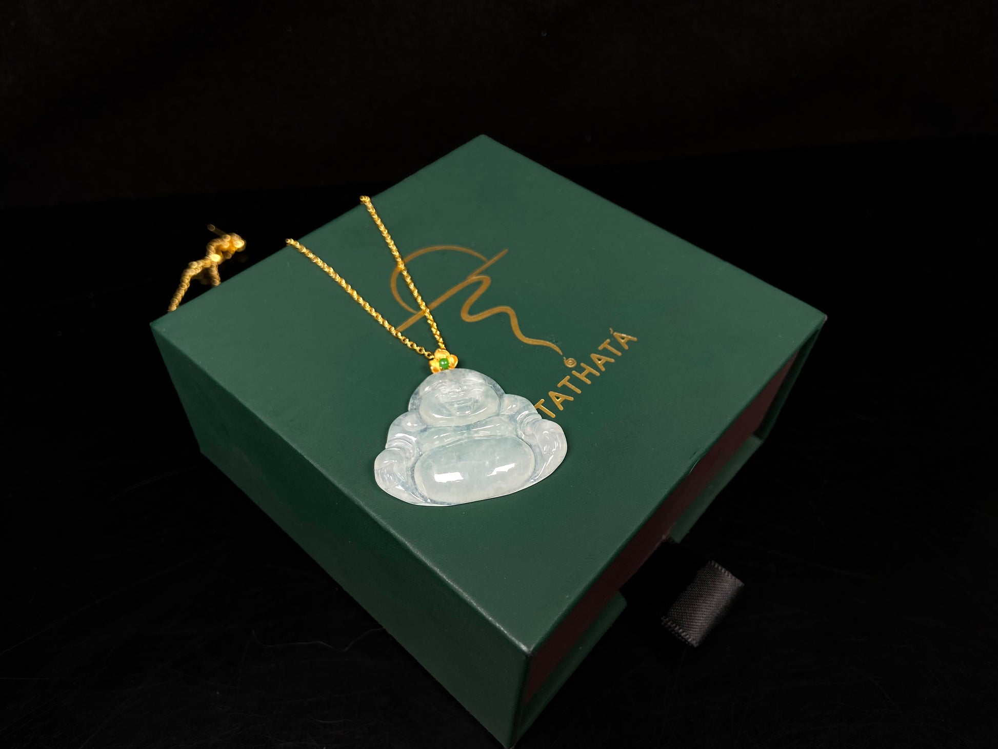 A icy pale green Maitreya jadeite pendant.