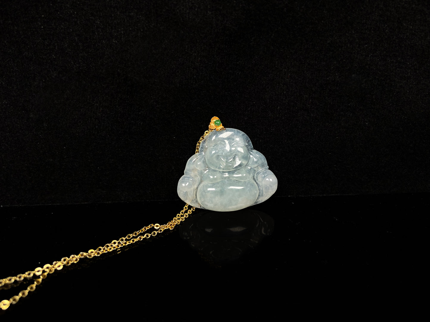 A icy pale green Maitreya jadeite pendant.