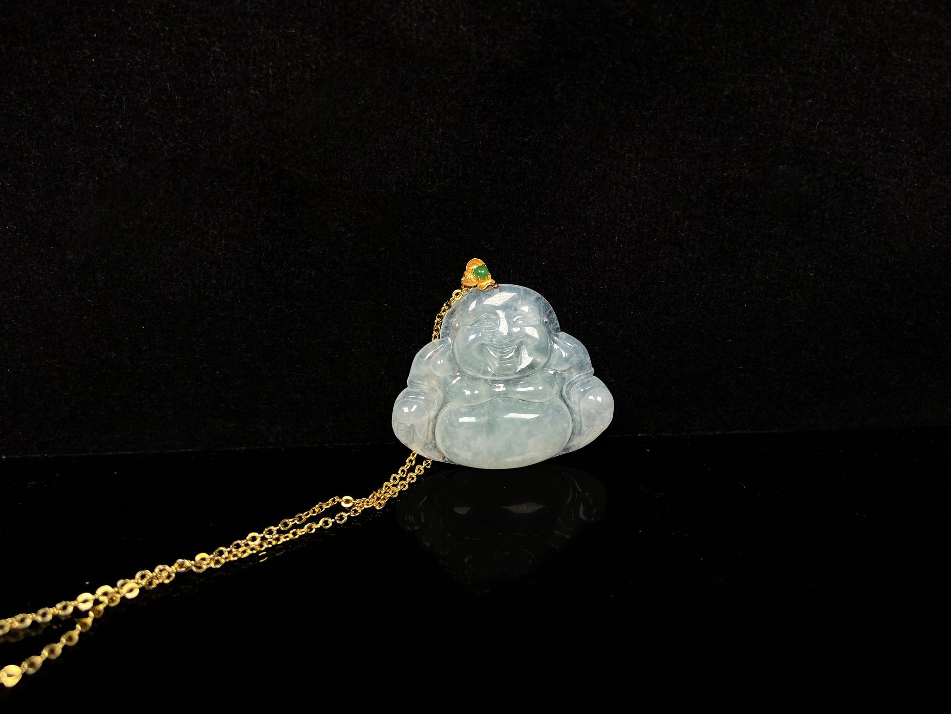 A icy pale green Maitreya jadeite pendant.
