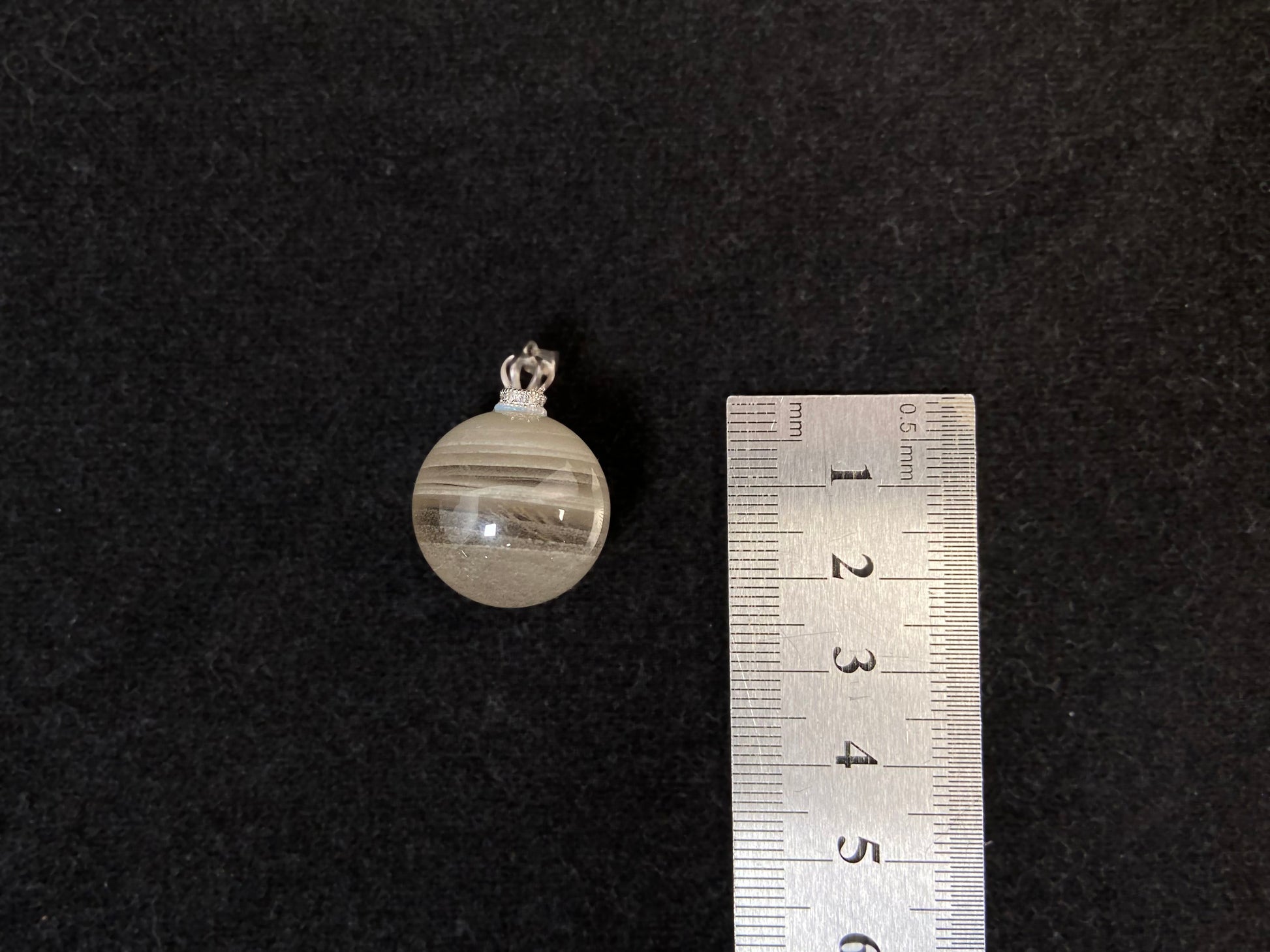 Layered White Phantom Quartz pendant.