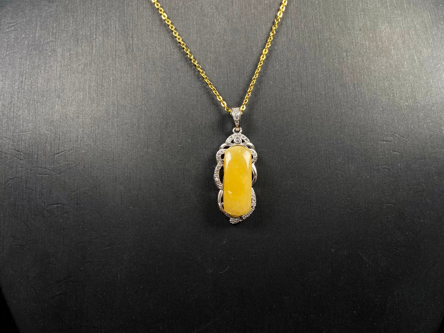 A gentle wheat yellow jadeite pendant.