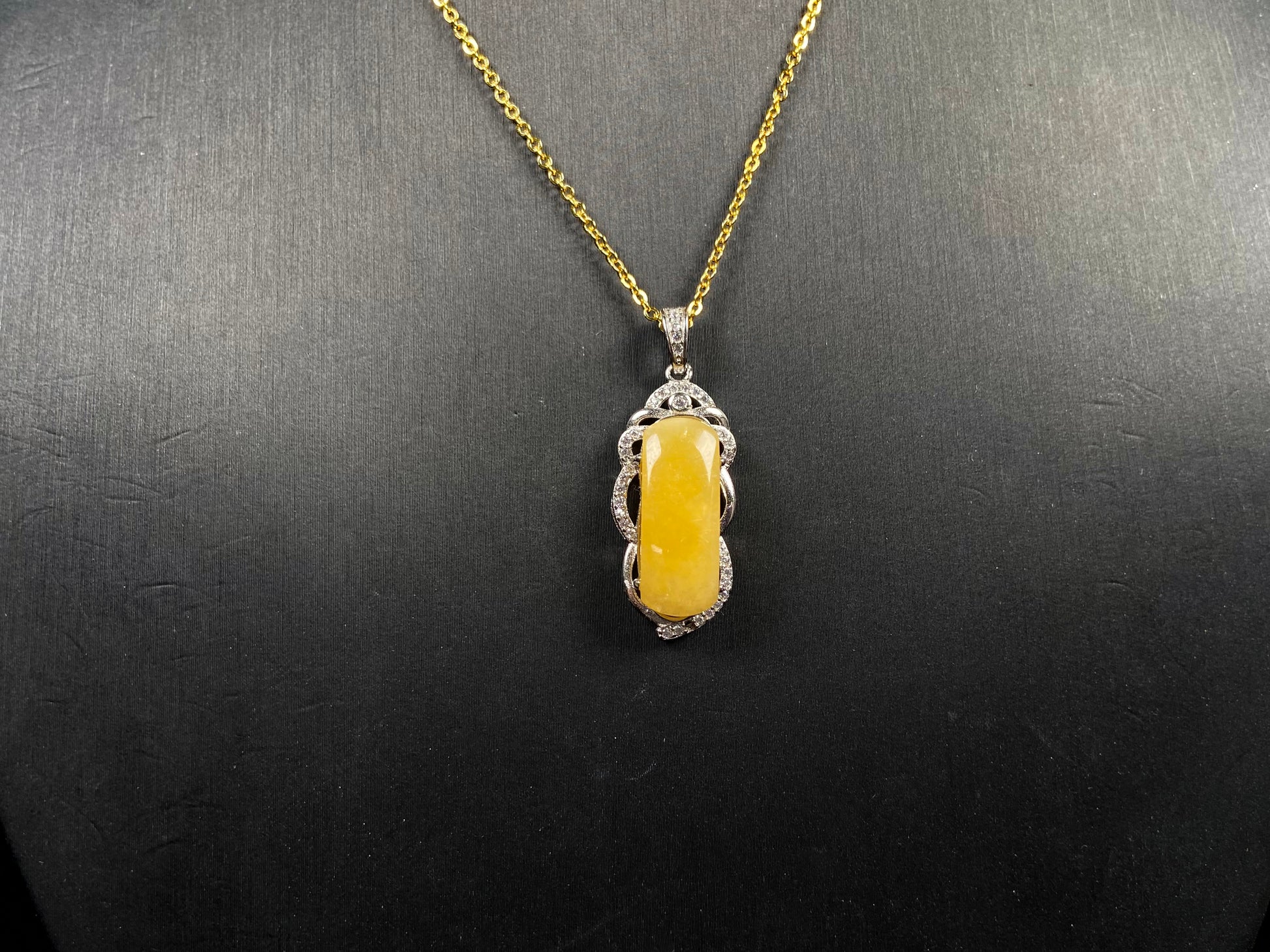 A gentle wheat yellow jadeite pendant.