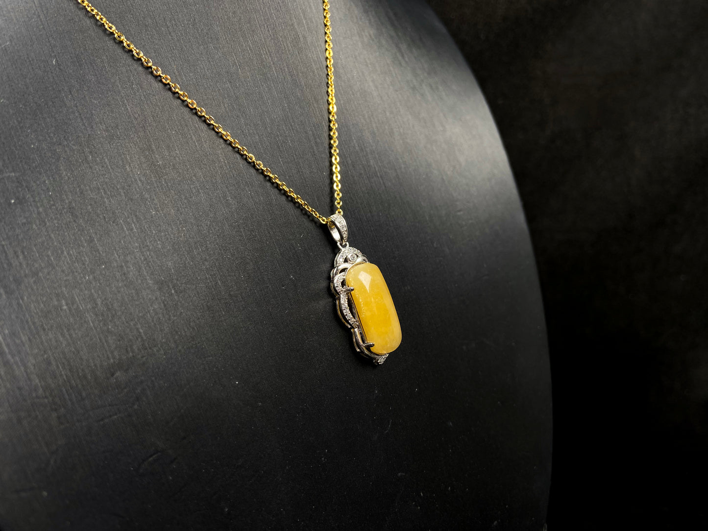 A gentle wheat yellow jadeite pendant.