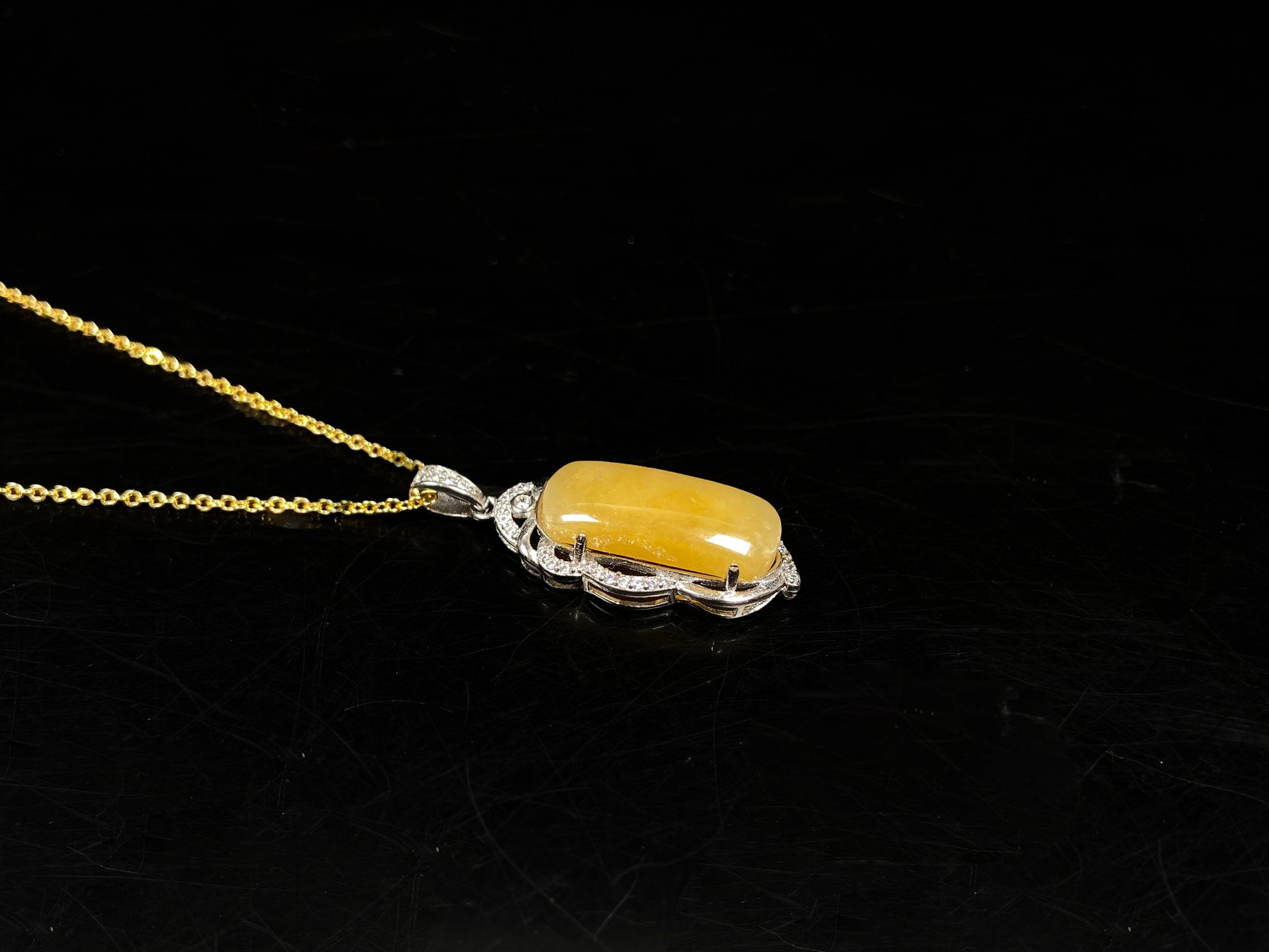 A gentle wheat yellow jadeite pendant.
