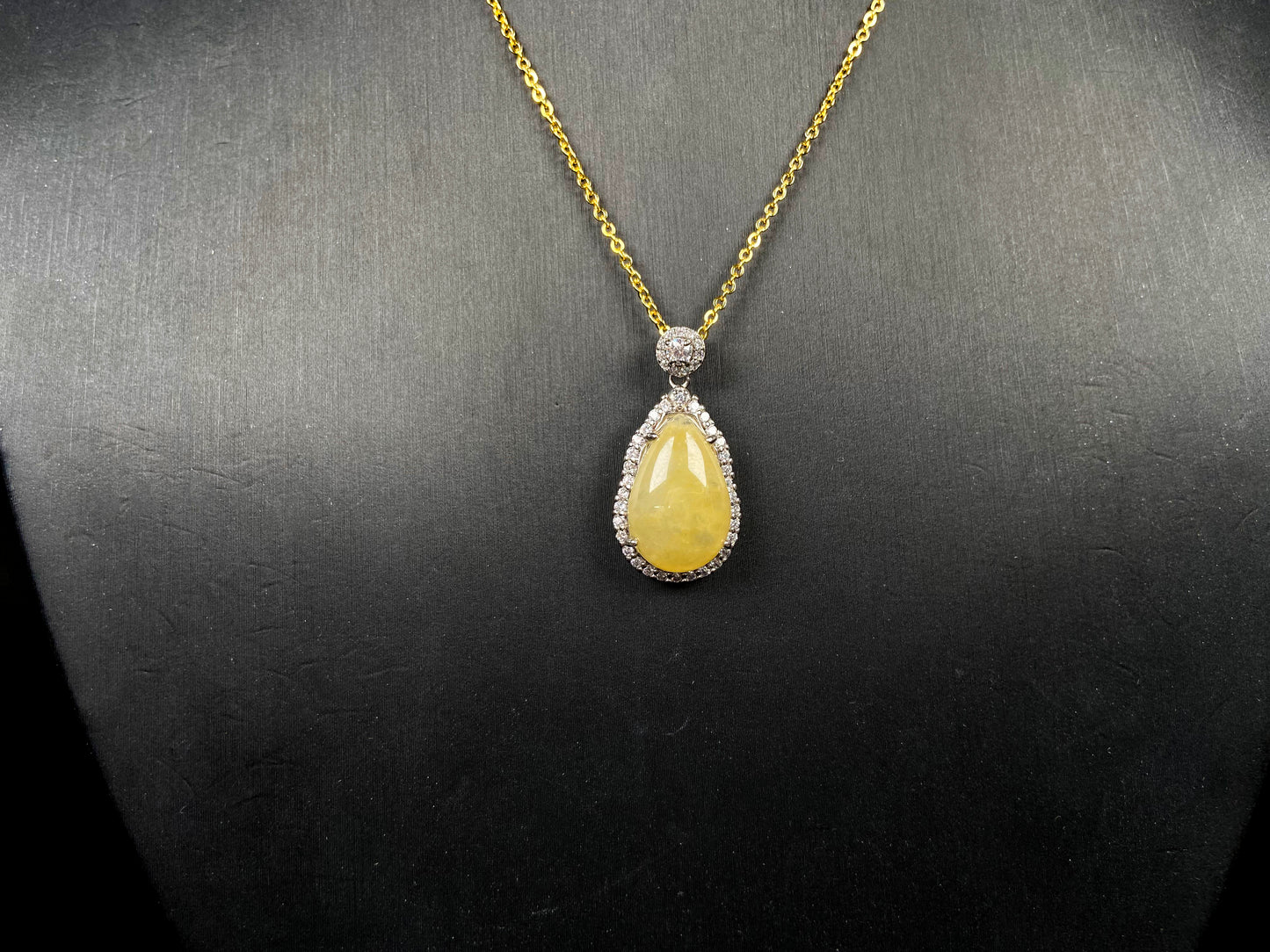 A yellow jadeite pendant.