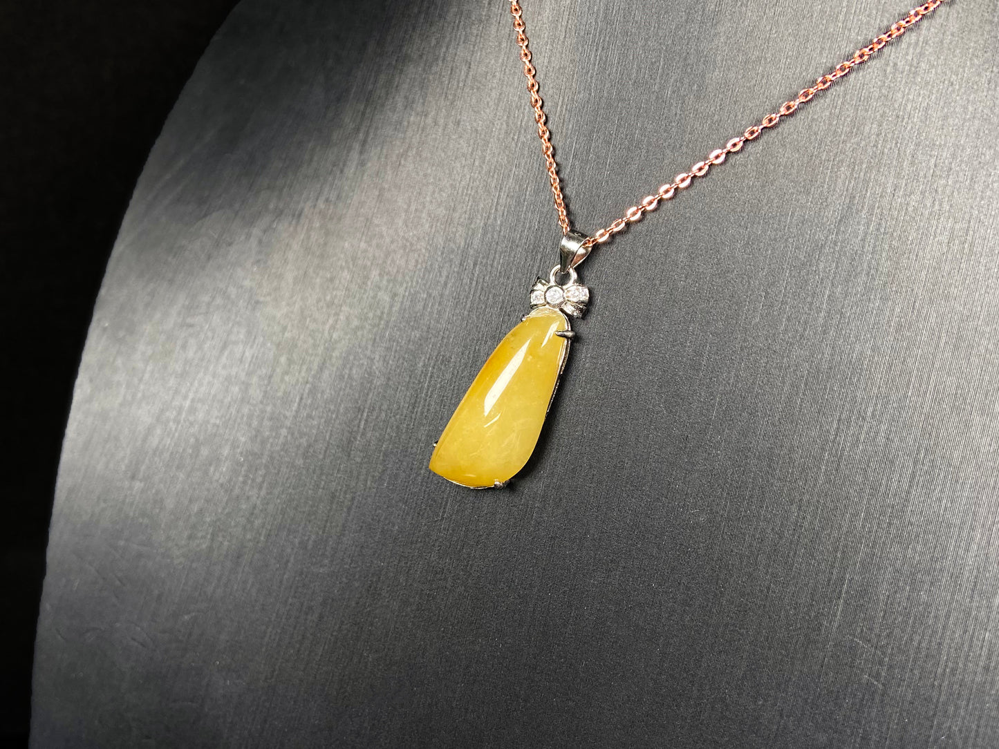 A vibrant yellow fortune melon jadeite pendant.