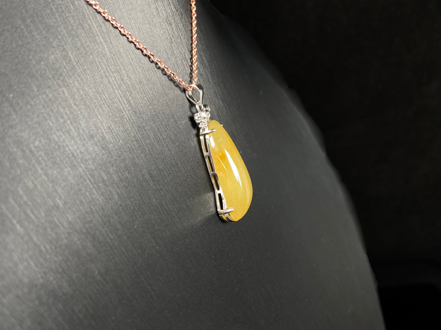 A vibrant yellow fortune melon jadeite pendant.