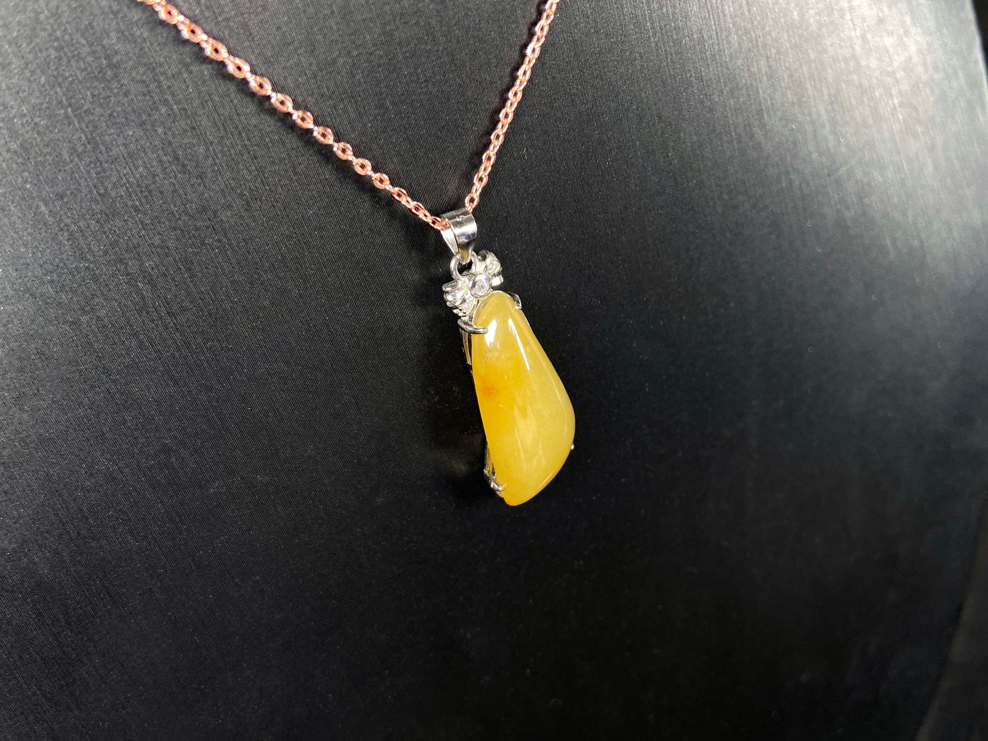 A vibrant yellow fortune melon jadeite pendant.