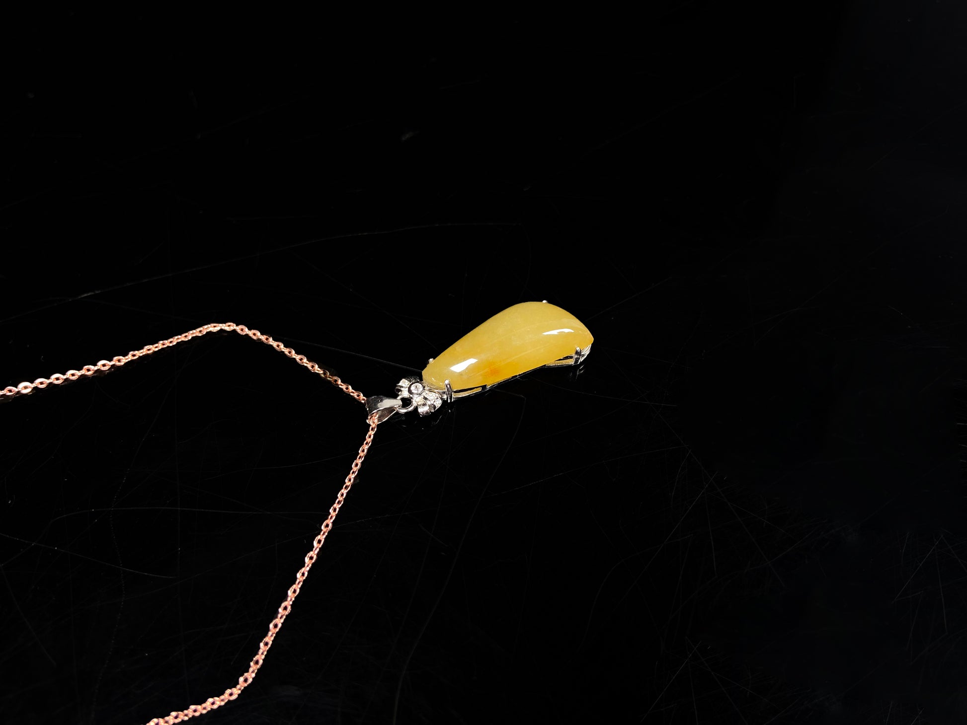 A vibrant yellow fortune melon jadeite pendant.