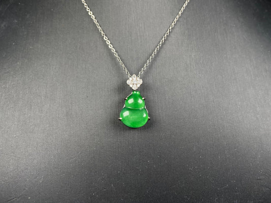 A diamond floral green hulu jadeite pendant.