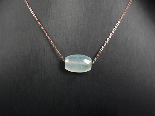 A translucent pale aqua Lu Lu Tong jadeite pendant.