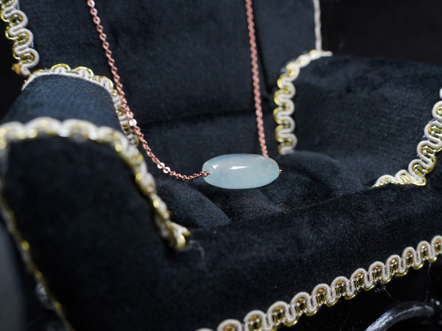 A translucent pale aqua Lu Lu Tong jadeite pendant.