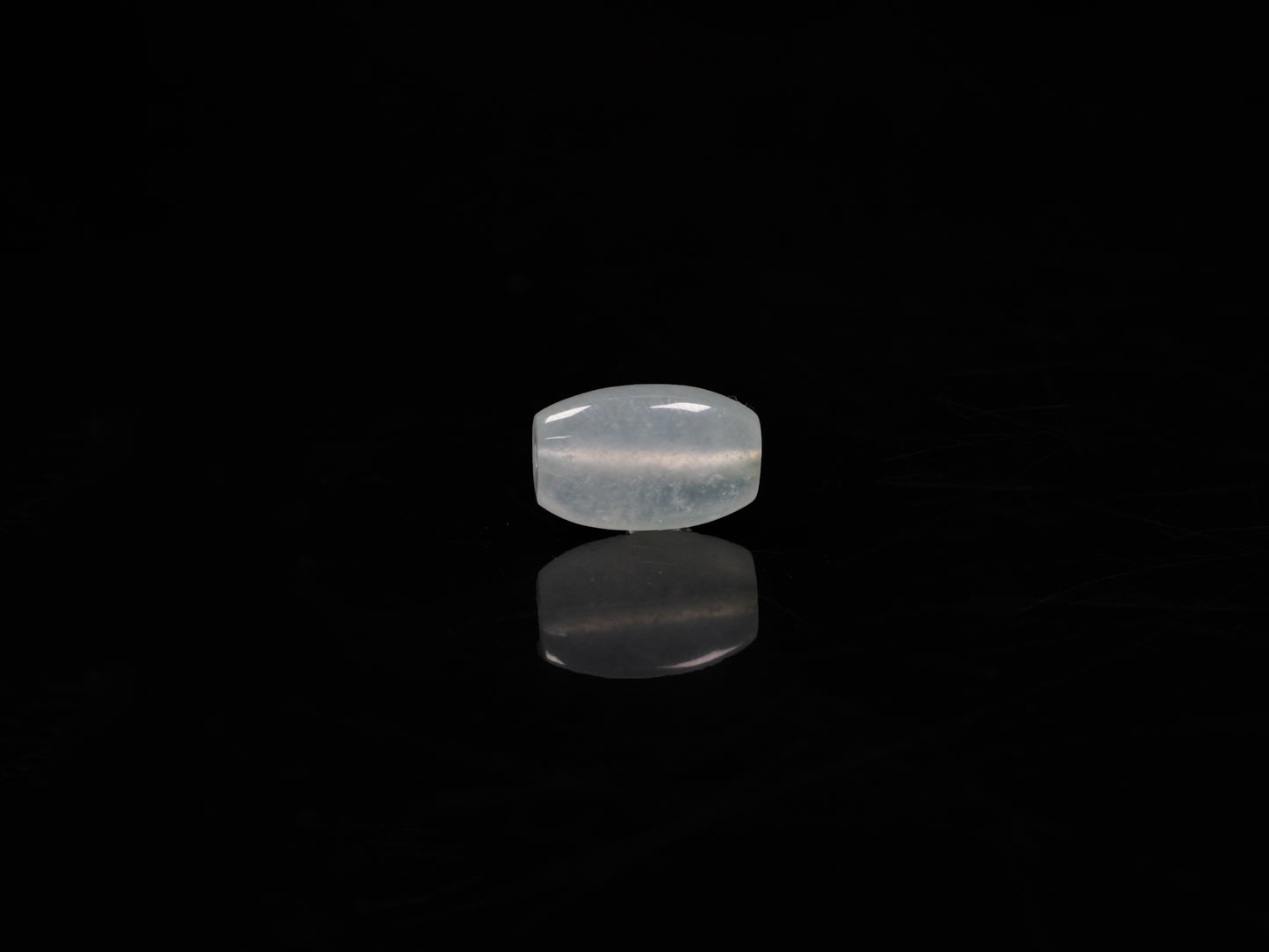 A translucent pale aqua Lu Lu Tong jadeite pendant.