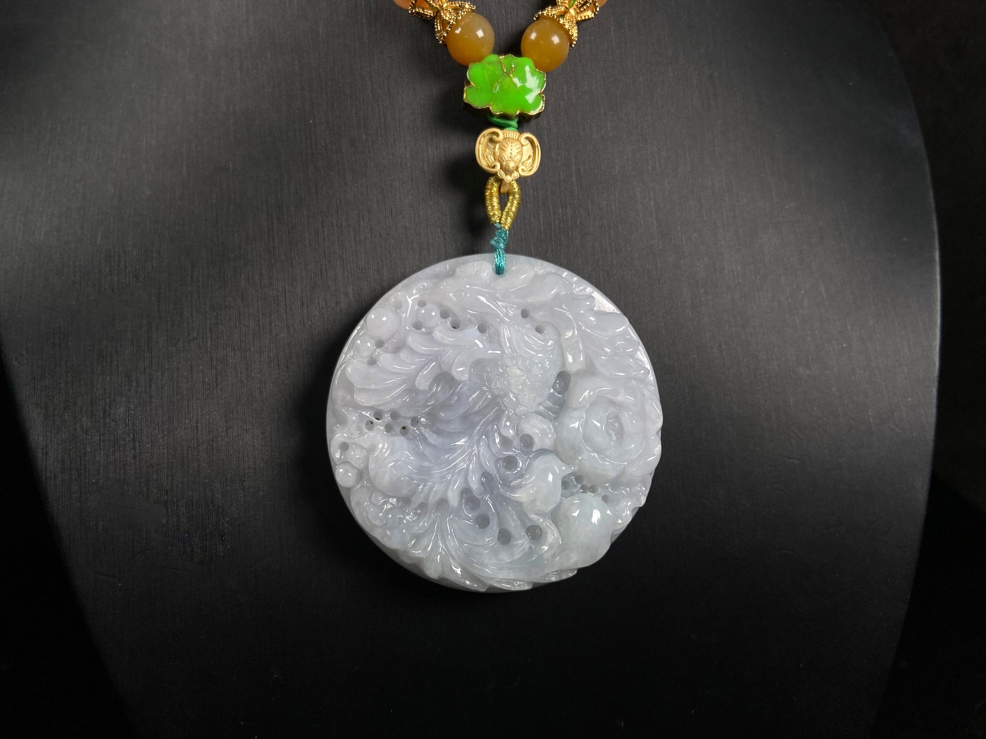 A white base violet kissed phoenix jadeite pendant.