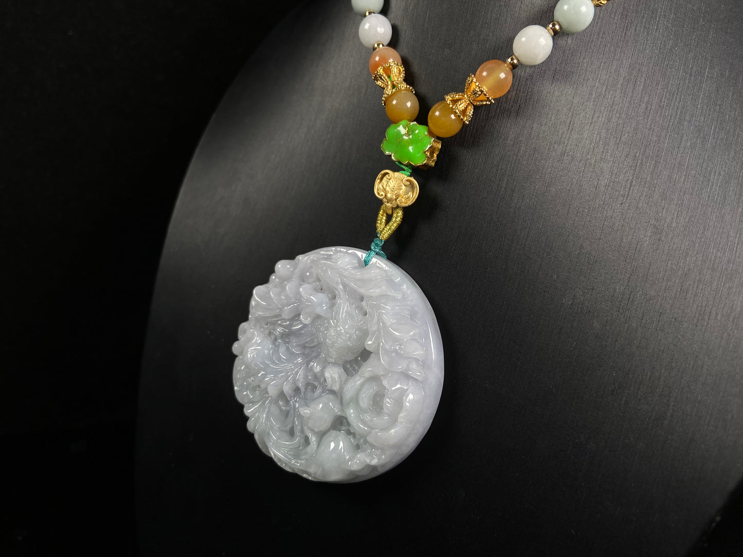 A white base violet kissed phoenix jadeite pendant.