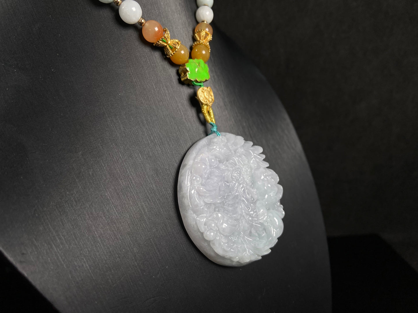 A white base violet kissed phoenix jadeite pendant.