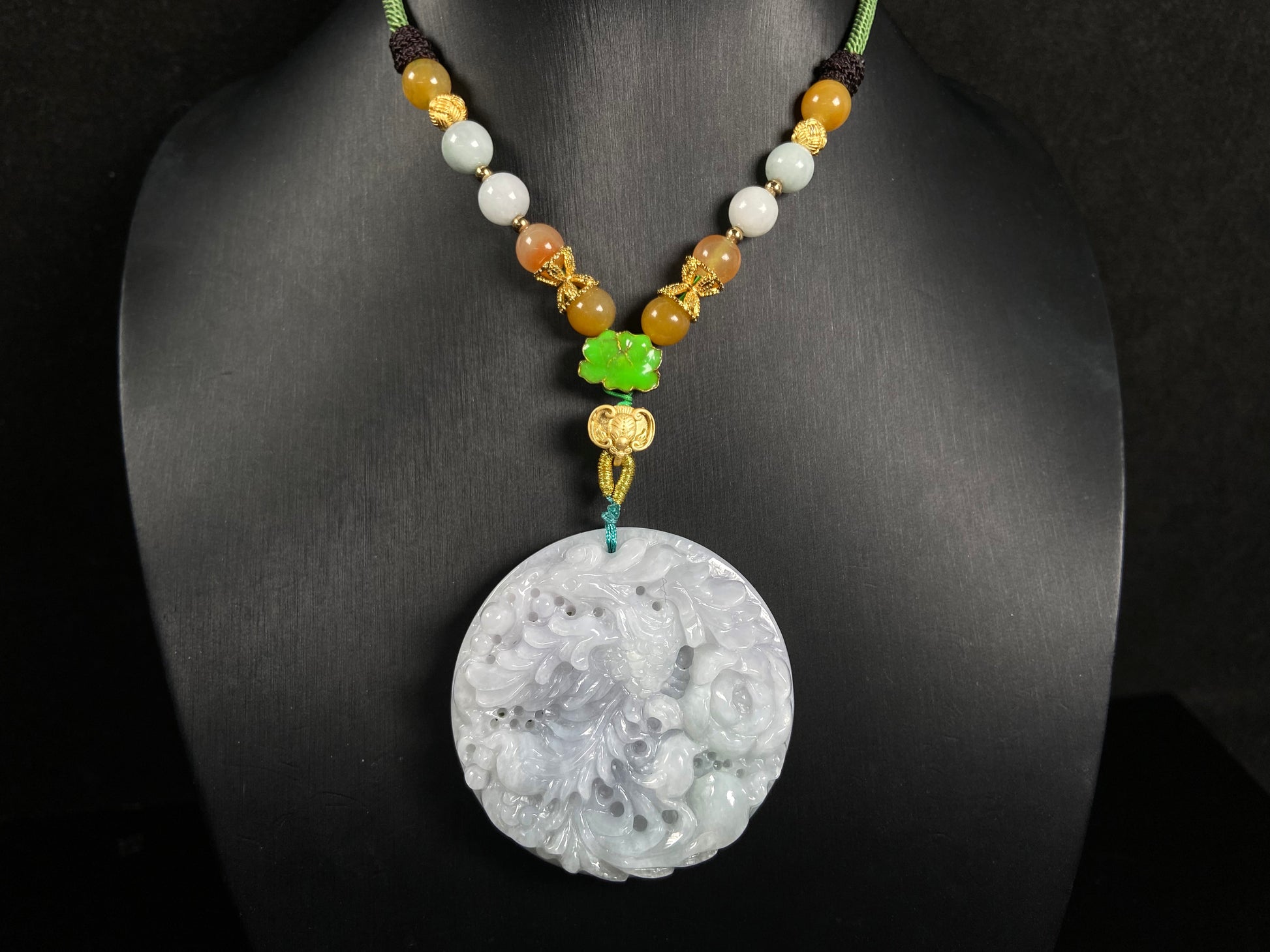 A white base violet kissed phoenix jadeite pendant.