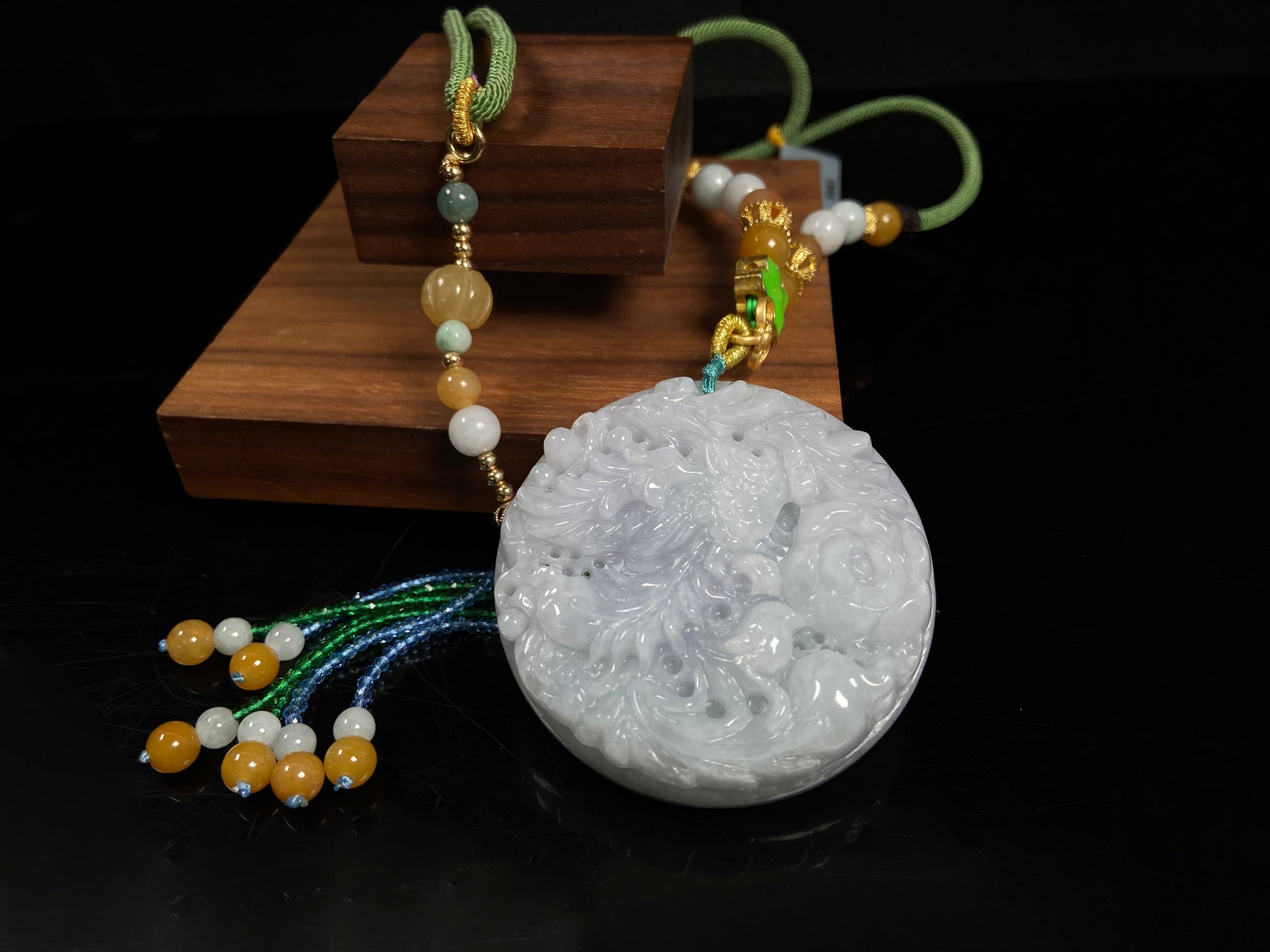 A white base violet kissed phoenix jadeite pendant.