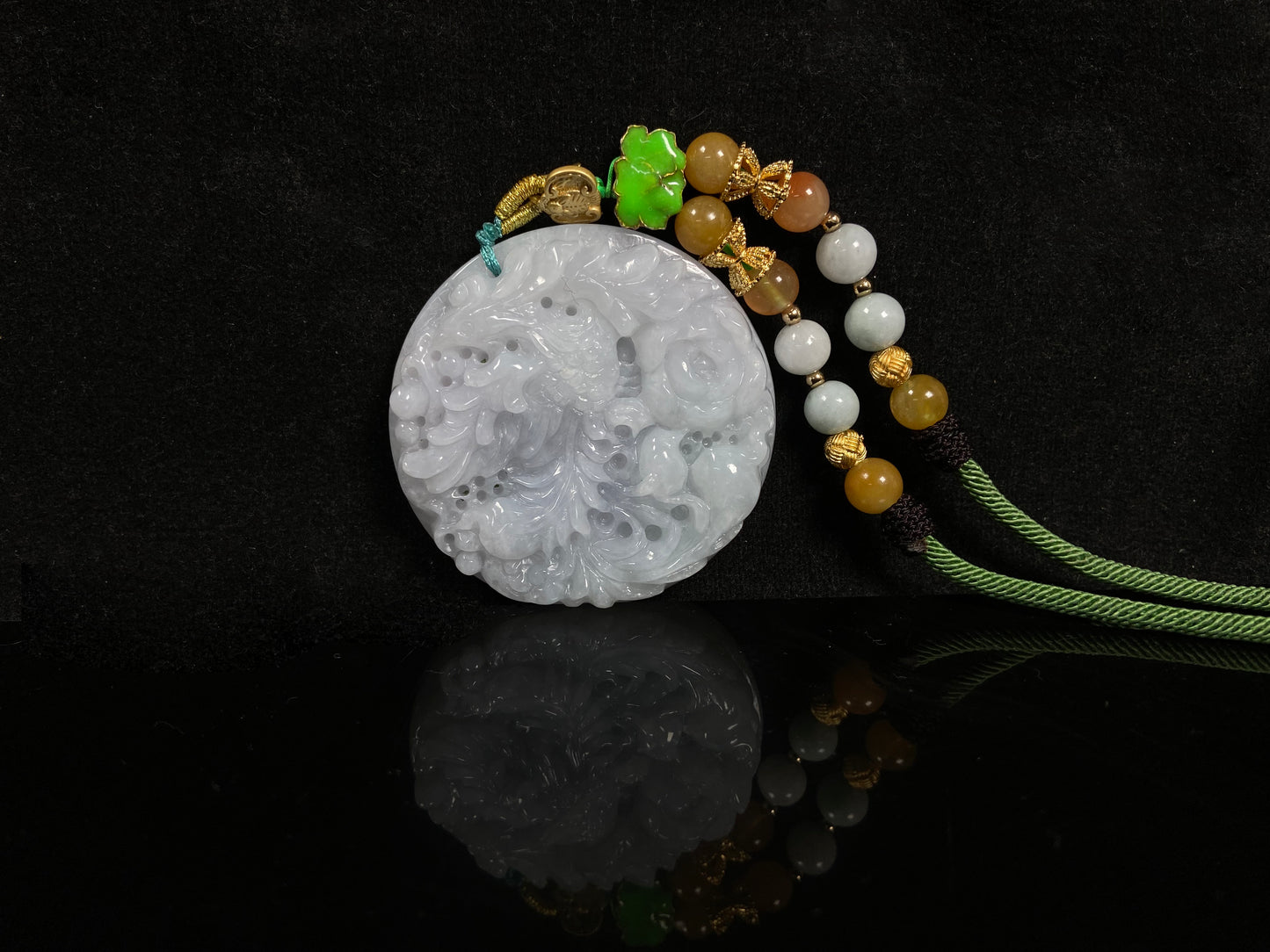 A white base violet kissed phoenix jadeite pendant.