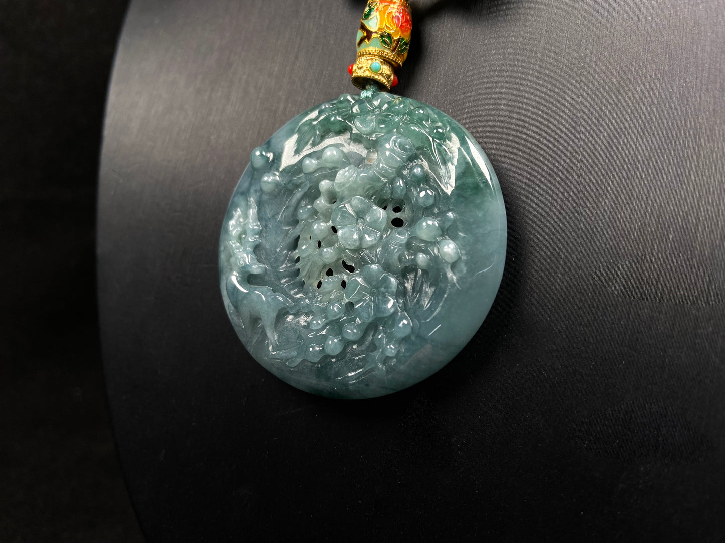 A cyan blue deer jadeite pendant.