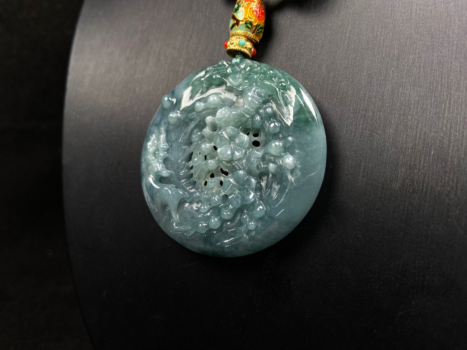 A cyan blue deer jadeite pendant.