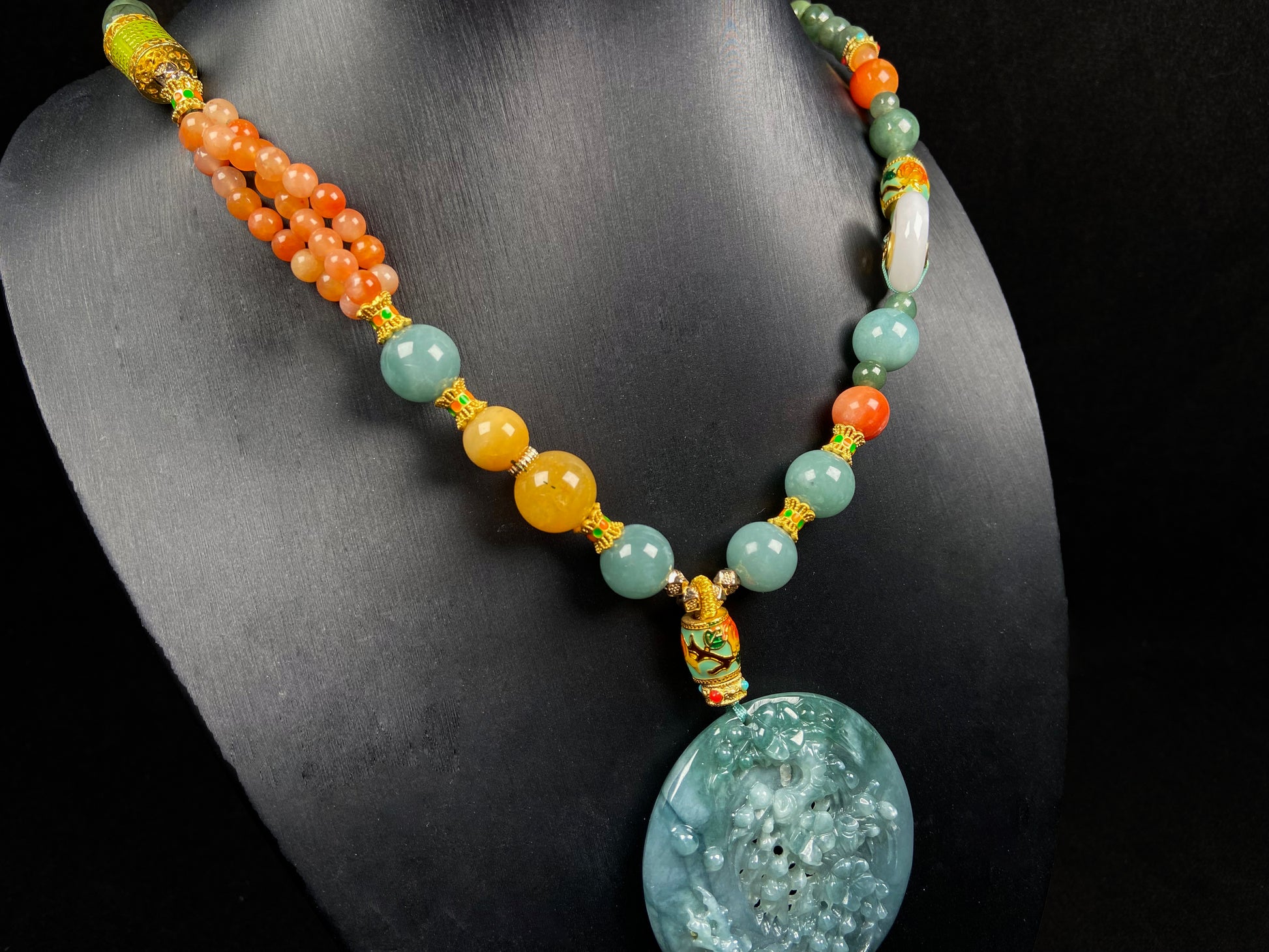 A cyan blue deer jadeite pendant.