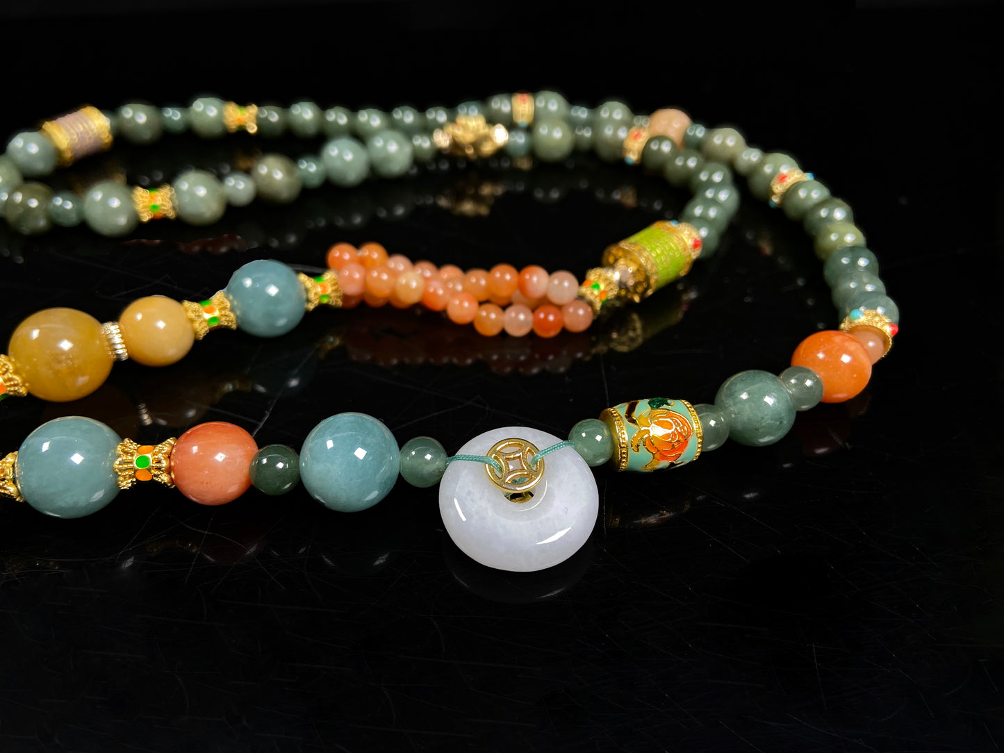 A cyan blue deer jadeite pendant.