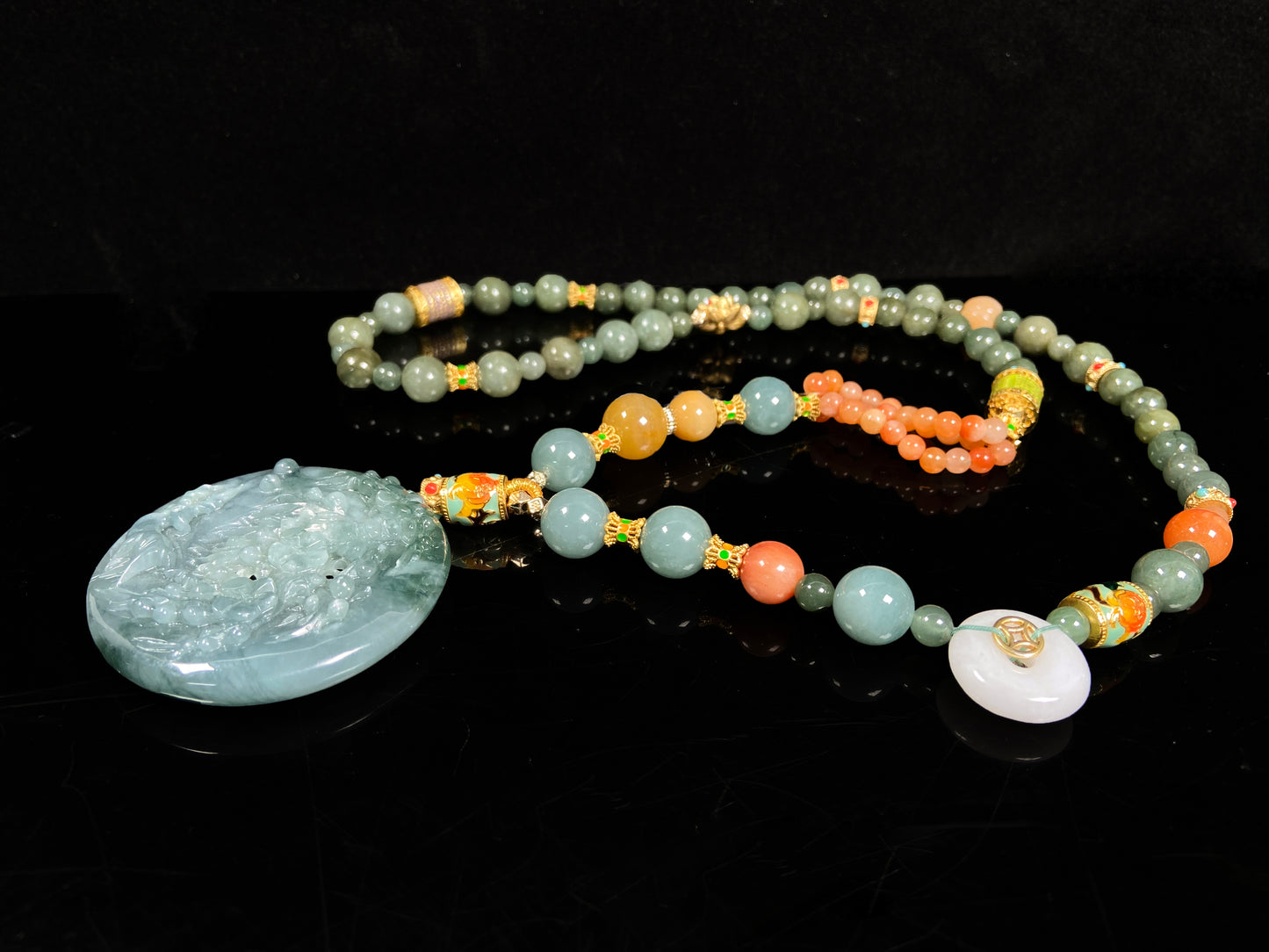 A cyan blue deer jadeite pendant.