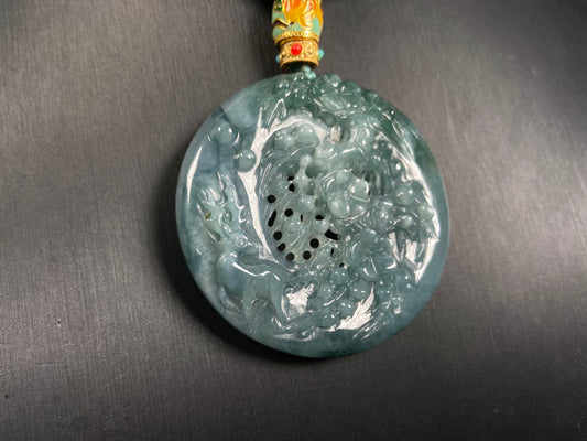 A cyan blue deer jadeite pendant.