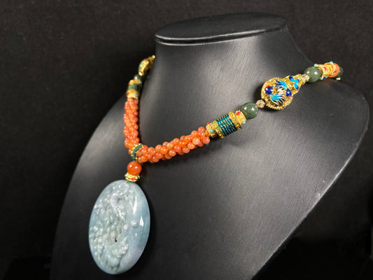A pale white blue deer coral jadeite pendant.