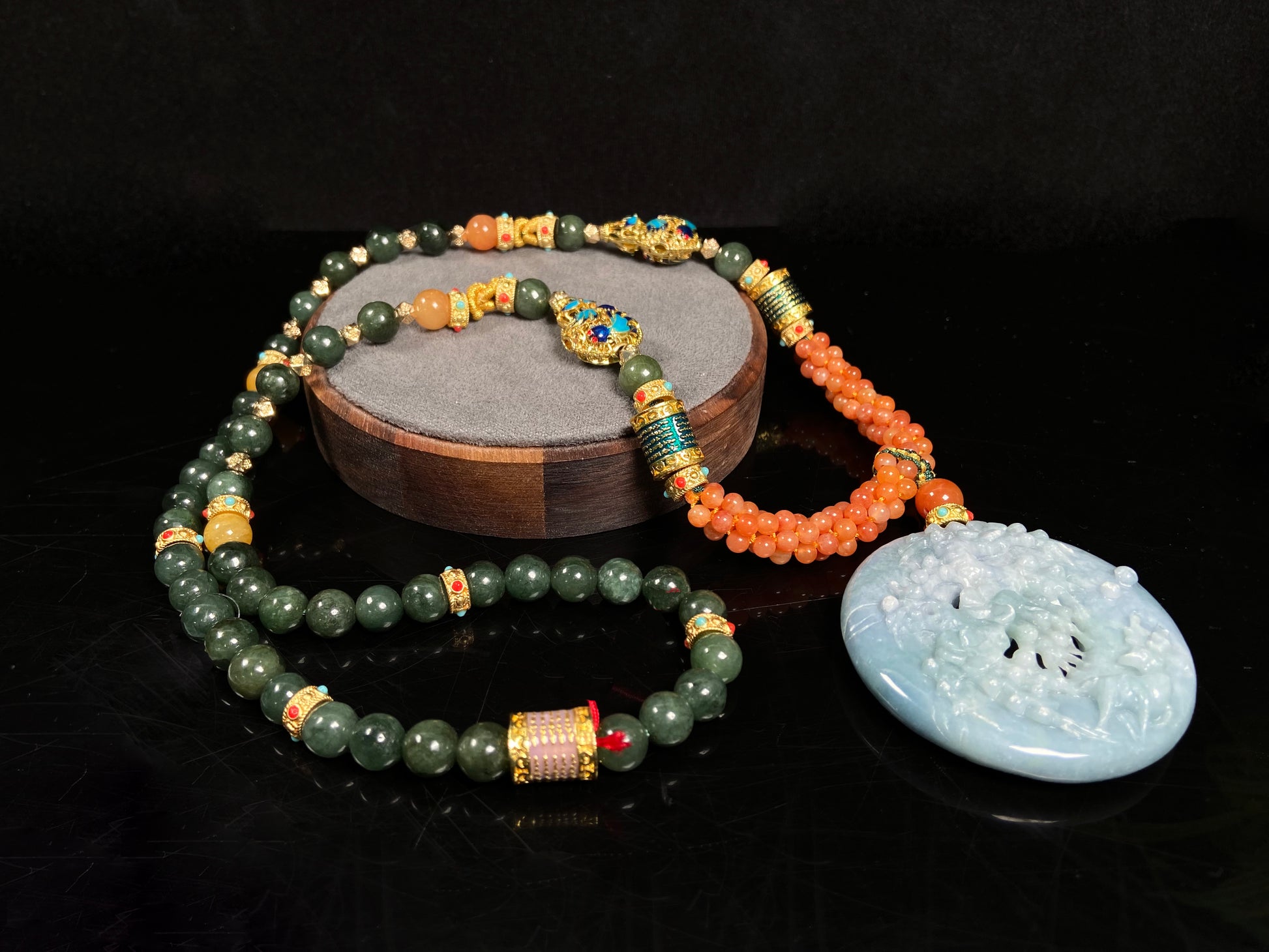 A pale white blue deer coral jadeite pendant.