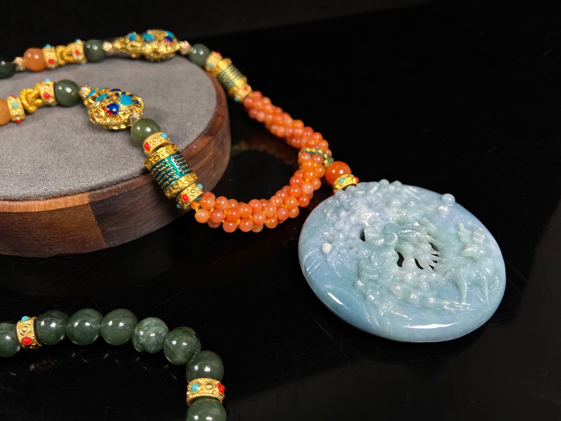 A pale white blue deer coral jadeite pendant.