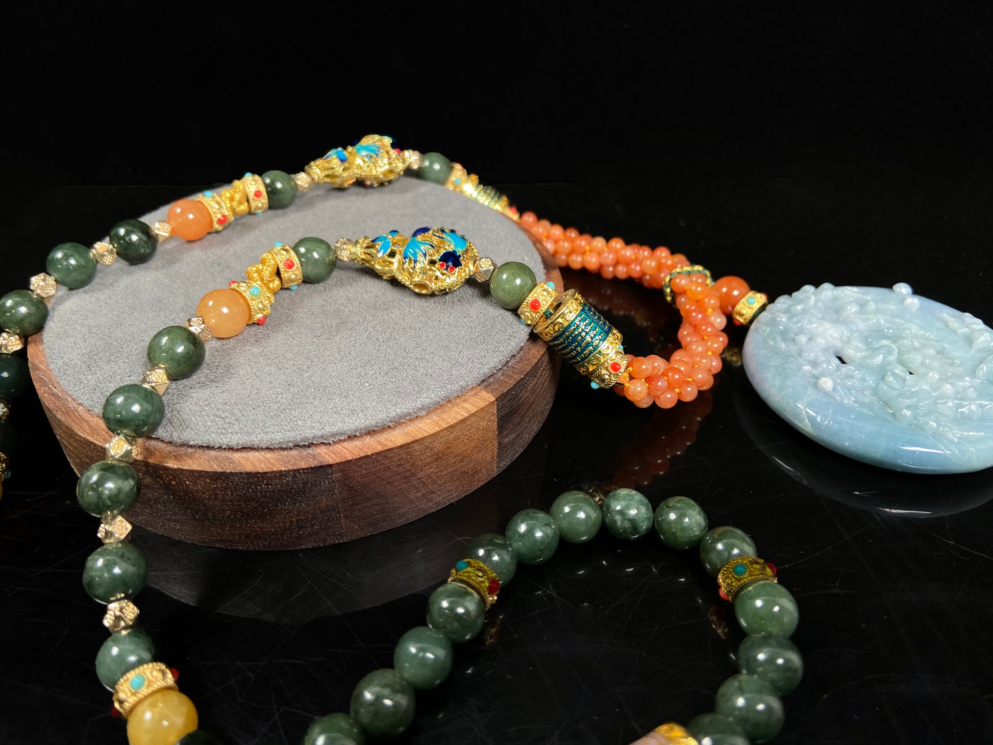 A pale white blue deer coral jadeite pendant.