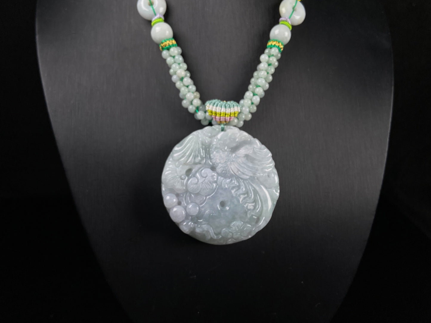 A phoenix among clouds jadeite pendant.