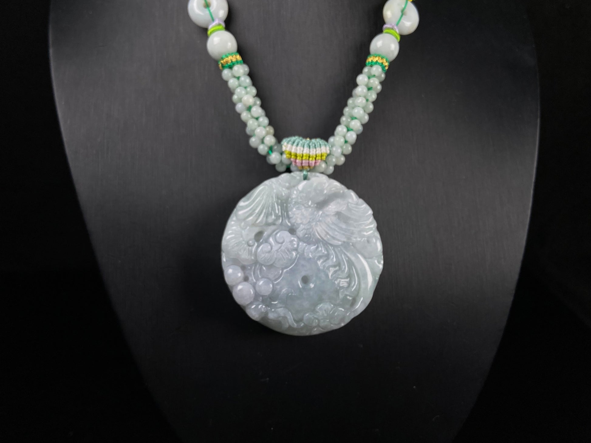 A phoenix among clouds jadeite pendant.