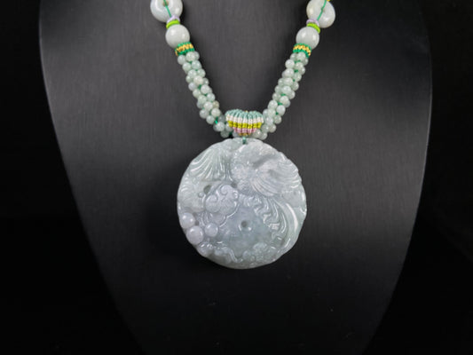 A phoenix among clouds jadeite pendant.