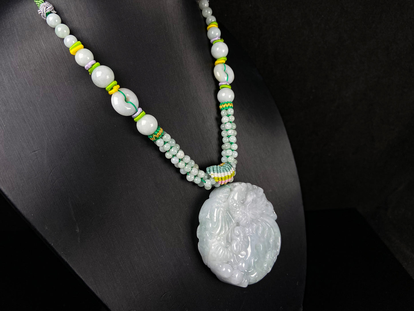 A phoenix among clouds jadeite pendant.