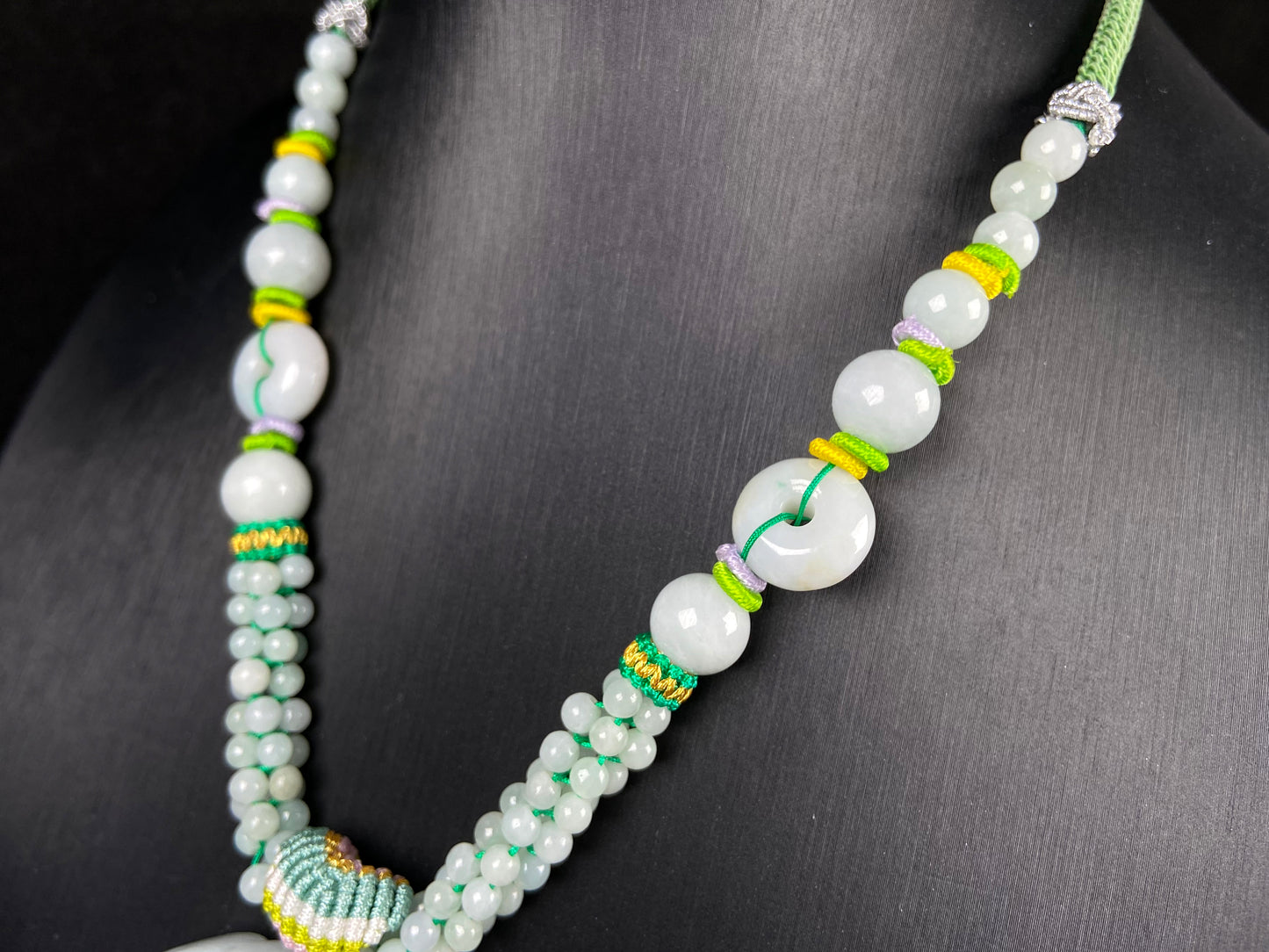 A phoenix among clouds jadeite pendant.