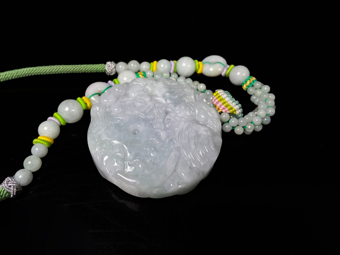 A phoenix among clouds jadeite pendant.