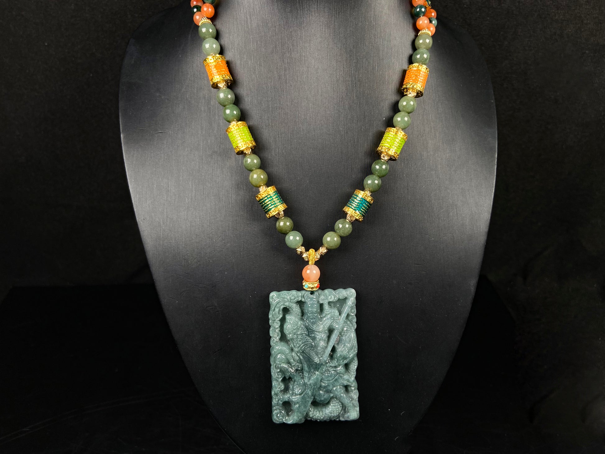 A deep green mighty guan gong jadeite pendant.